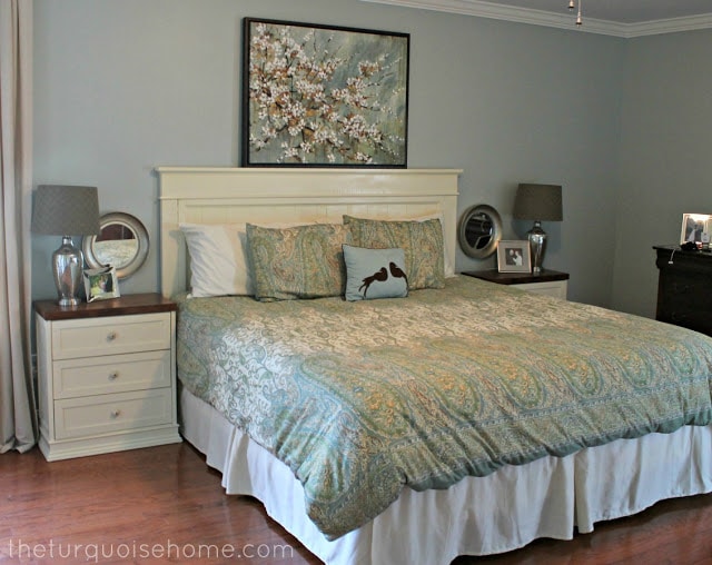 bedroom with large art over the bed.