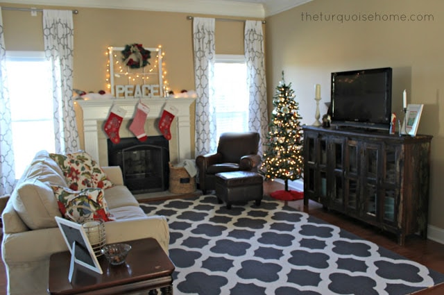 BEFORE: Gorgeous Living Room Makeover with beautiful DIY board and batten, Pottery Barn sofa, stenciled curtains, warm wood and pops of turquoise!