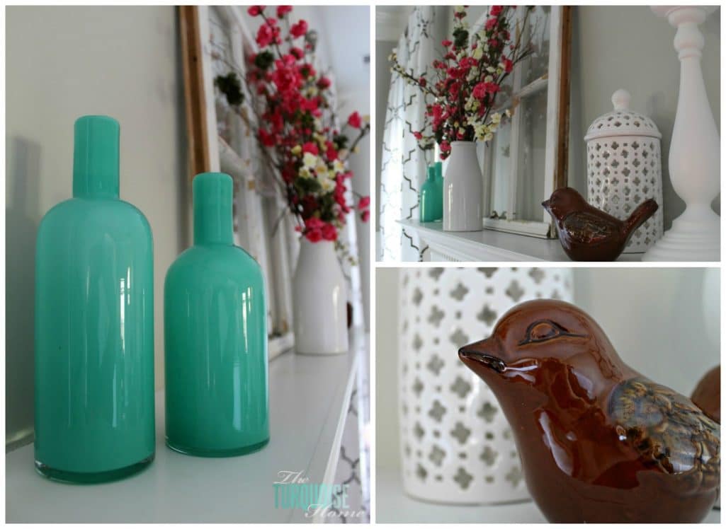 Blue vases and brown bird figurine on mantel