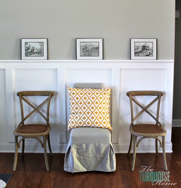 Gorgeous Living Room Makeover with beautiful DIY board and batten, Pottery Barn sofa, stenciled curtains, warm wood and pops of turquoise!