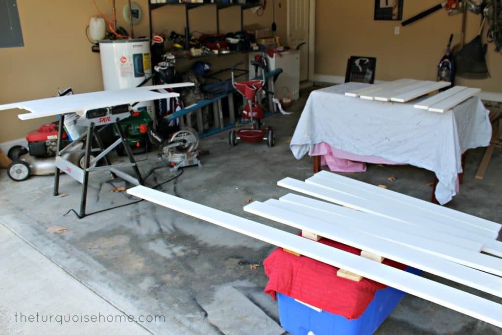 prepping white boards in garage for board and batten