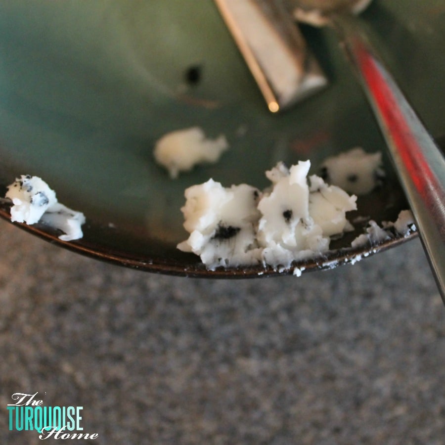 Remove all of the old burned candle pieces