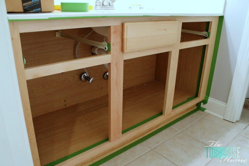When painting cabinets, tape off the walls and floors so you don't have to be precise! And you don't make a mess.
