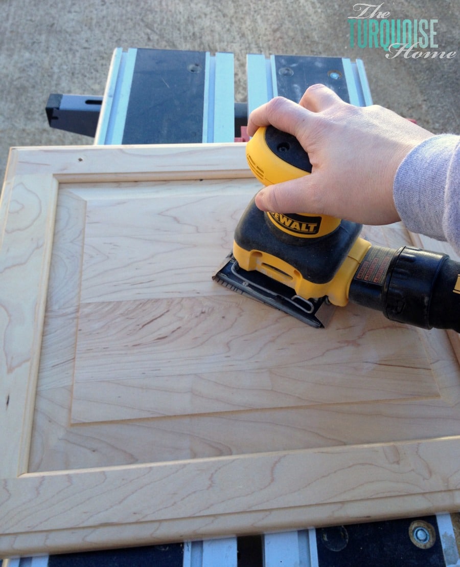 Painting cabinets isn't overwhelming when you break it down into these simple steps! Sanding the cabinets is so much easier with an electrical sander!