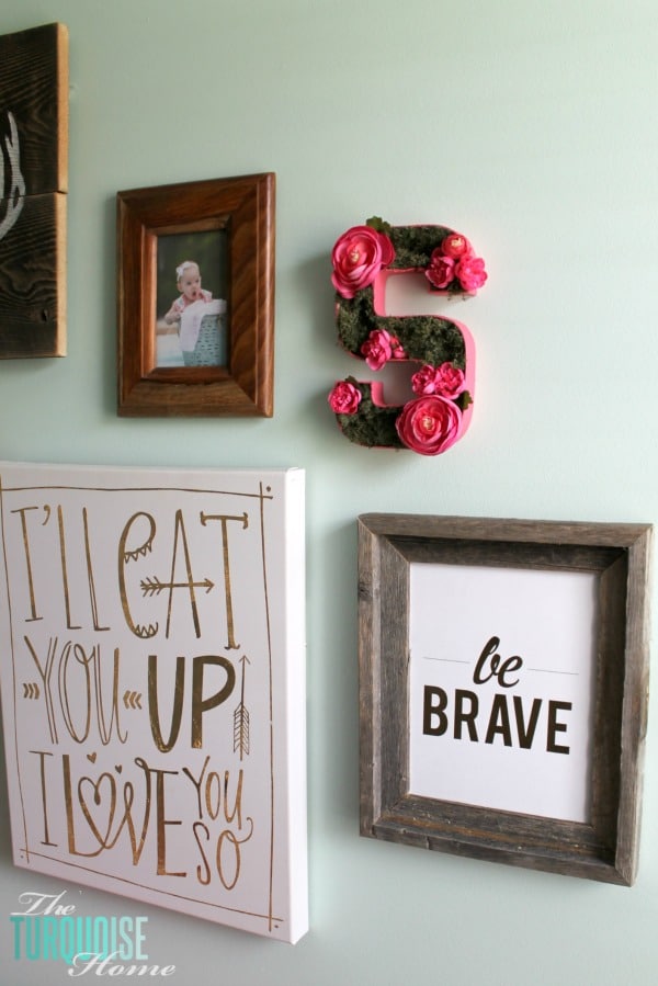 Such a sweet, girly gallery wall in a woodland nursery. All of the details at TheTurquoiseHome.com