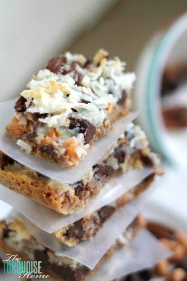This quick and easy dessert is the traditional and yummy Hello Dolly Bar, but can also be called a Magic Bar or a 7 Layer Bar. Whatever you call it, the soft, delicious graham cracker crust, rich chocolate and crunchy coconut drizzled with sweetened condensed milk is so scrumptious that you'll be making them for every pool party this summer. | Recipe via TheTurquoiseHome.com