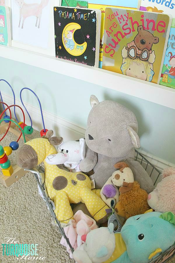 All of the pretty pink and turquoise touches with a woodland theme make a sweet retreat for any little girl. | Baby Girl's Woodland Nursery | All the details at TheTurquoiseHome.com