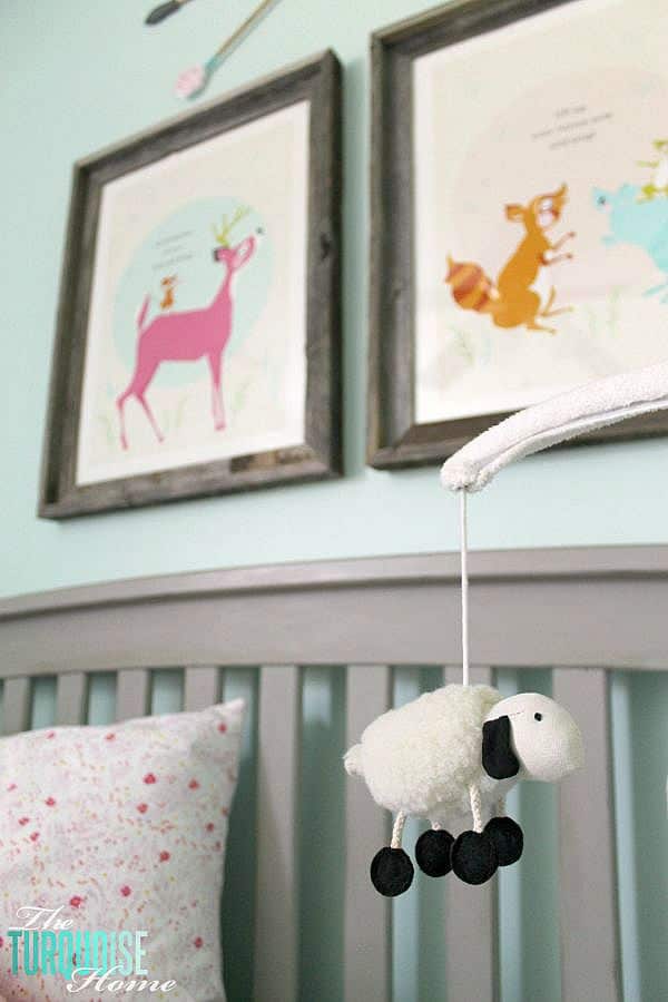 All of the pretty pink and turquoise touches with a woodland theme make a sweet retreat for any little girl. | Baby Girl's Woodland Nursery | All the details at TheTurquoiseHome.com