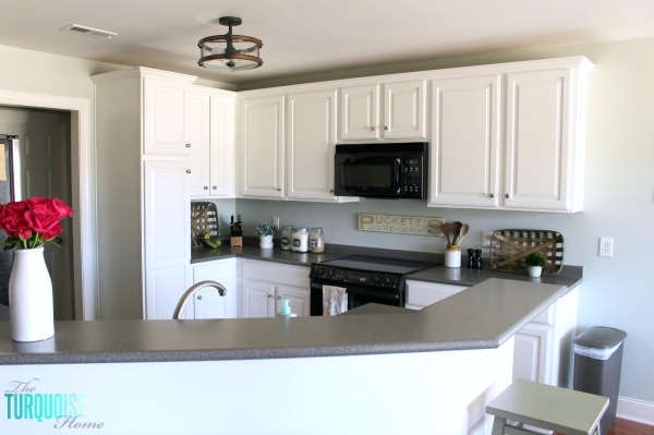 Love this light and airy farmhouse look!! Kitchen painted in Sea Salt (Sherwin Williams). | All the details at TheTurquoiseHome.com