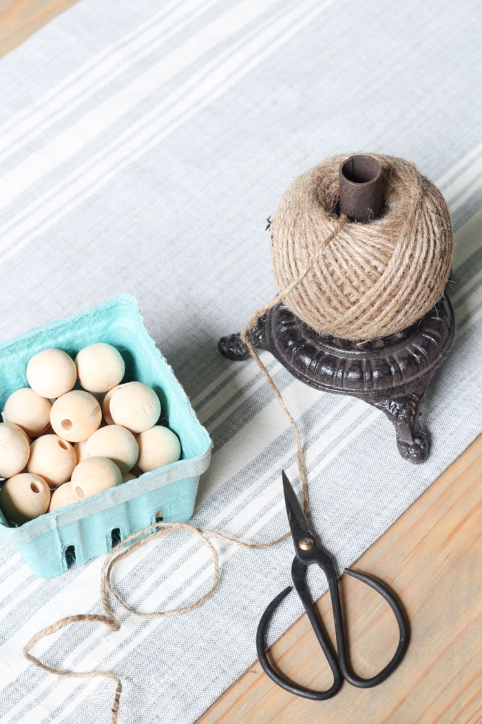 Super cute DIY Wood Bead Garland with Tassels is so easy and fun to make! Cheap, too!!
