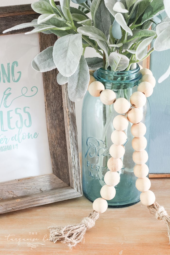 Super cute DIY Wood Bead Garland with Tassels is so easy and fun to make! Cheap, too!!
