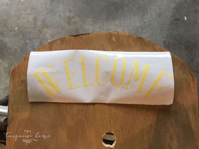 Use vinyl letters to create a welcoming message for your DIY Lighted Pumpkin Candy Holder.