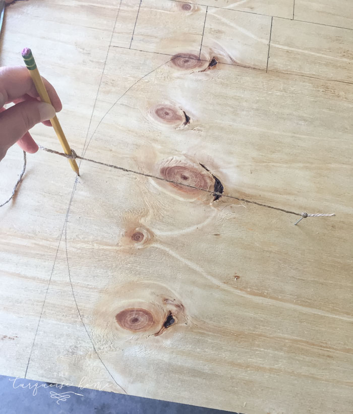 Draw an arc on the top of the gravestone/back of the box for the DIY Lighted Pumpkin Candy Holder.