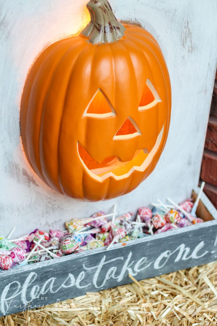 Such a cute option for giving away candy while you're away! DIY Lighted Pumpkin Candy Holder