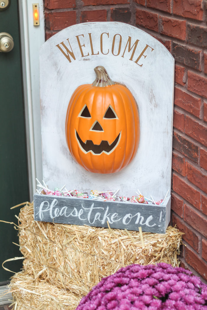 This adorable DIY Lighted Pumpkin Candy Holder is simple to make with just 2 supplies and a few regular household tools! Perfect for leaving behind while you take your kids trick-or-treating!!