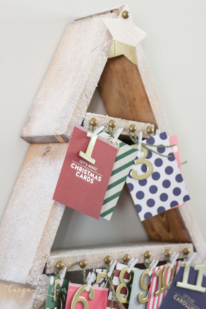 The most adorable DIY snowy Christmas Tree Shelf lends itself to the perfect spot for an advent calendar. LOVE it!!
