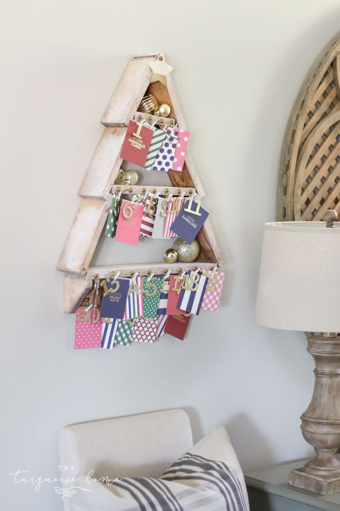 The most adorable DIY snowy Christmas Tree Shelf lends itself to the perfect spot for an advent calendar. LOVE it!!