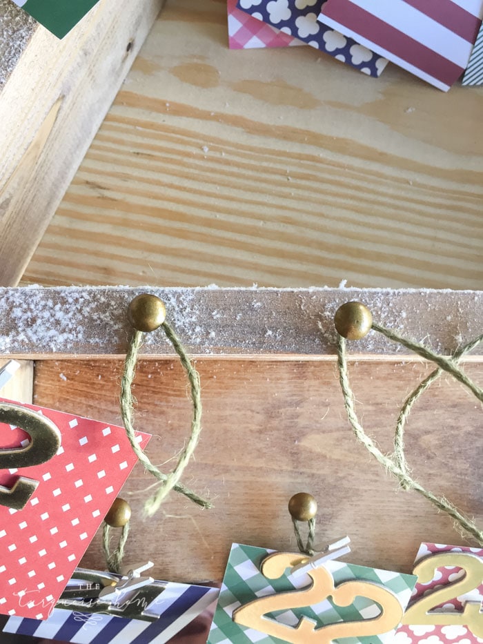Add brass nail tacks for the Advent Calendar ... The most adorable DIY snowy Christmas Tree Shelf lends itself to the perfect spot for an advent calendar. LOVE it!!