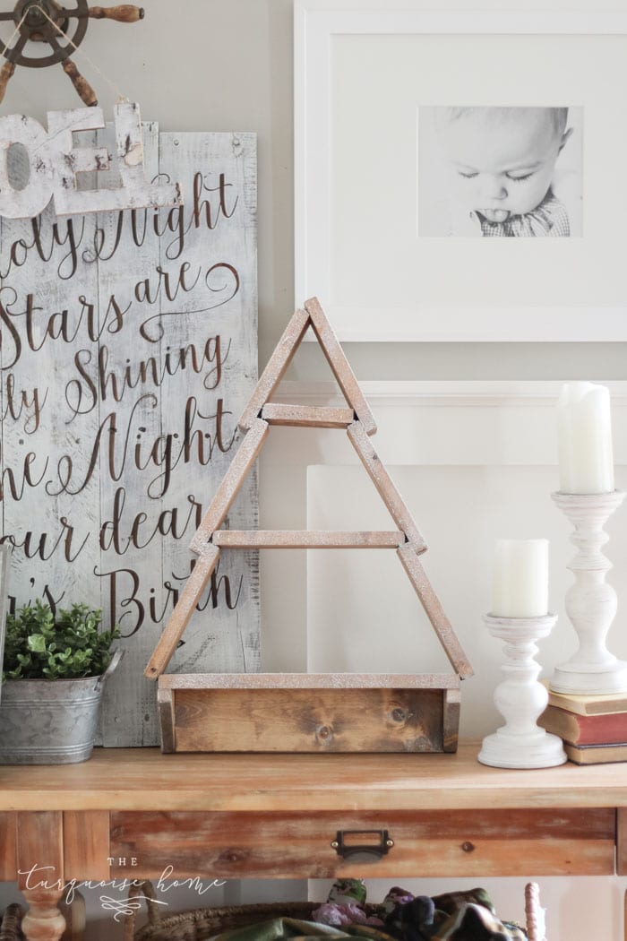 The most adorable DIY snowy Christmas Tree Shelf lends itself to the perfect spot for an advent calendar. LOVE it!!