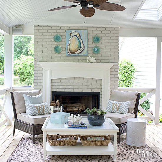 Gorgeous fireplace in an outside seating area. Love these coastal vibes for the front porch!