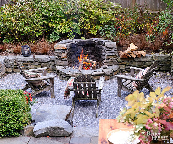 Dreamy Rock Fire Pit sitting area with wooden Adirondack chairs.