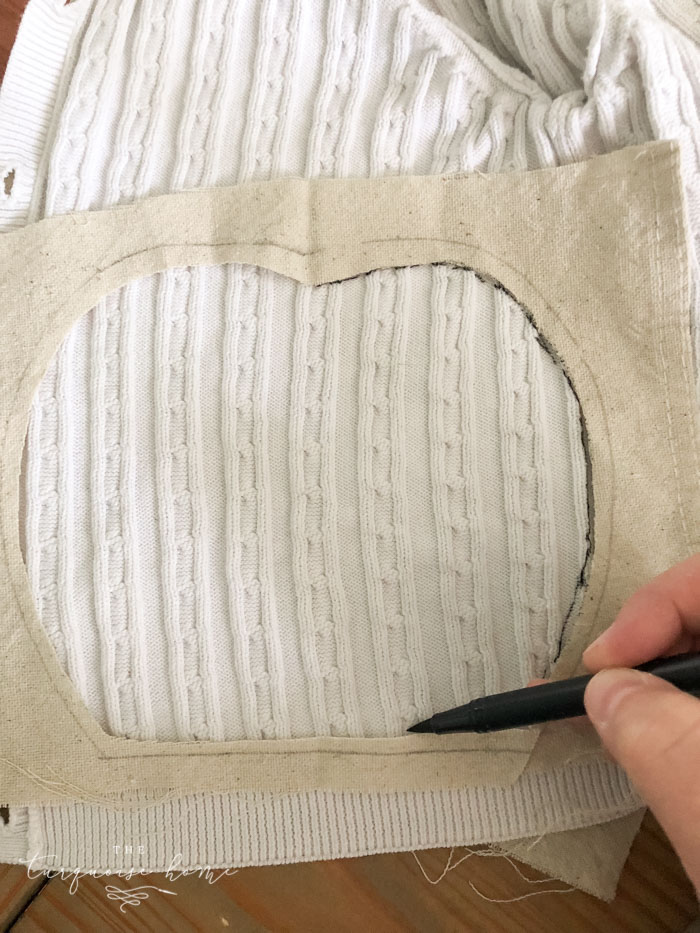 Cut out a cable knit sweater to add cozy texture to an otherwise plain pumpkin.