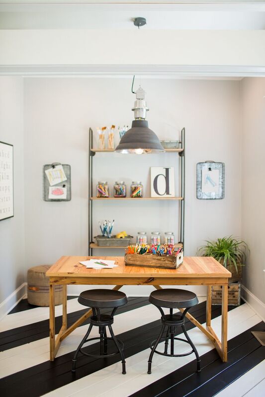 fun and functional homeowkr space with striped floors.