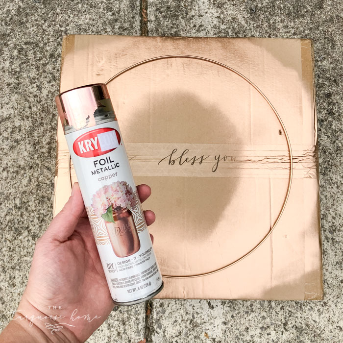 Spray paint the wreath hoop with copper metallic spray paint.