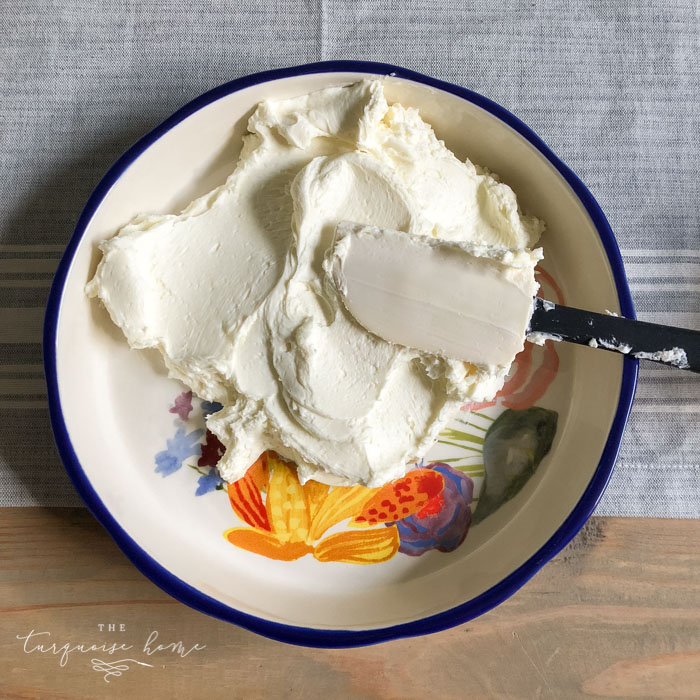 Spread the cream cheese and sugar mixture in the bottom of your pretty serving dish. | Cream Cheese Caramel Apple Dip Recipe