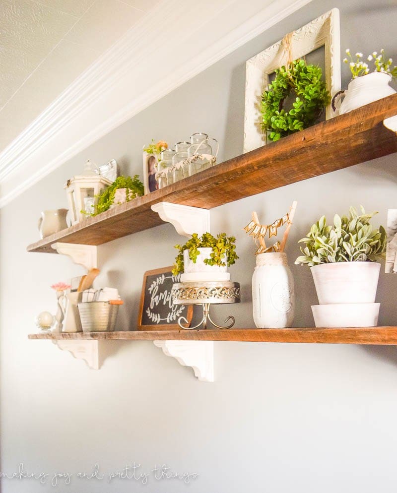 rustic farmhouse open shelves held up with white corbels.