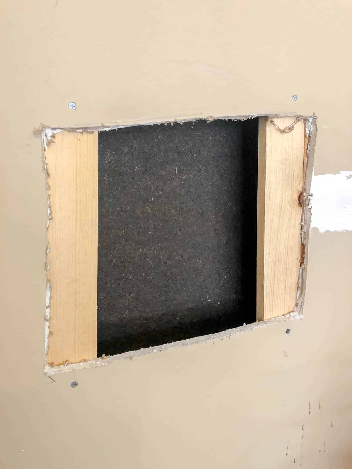 cut a larger hole than your damaged wall to make a large hole wall repair.