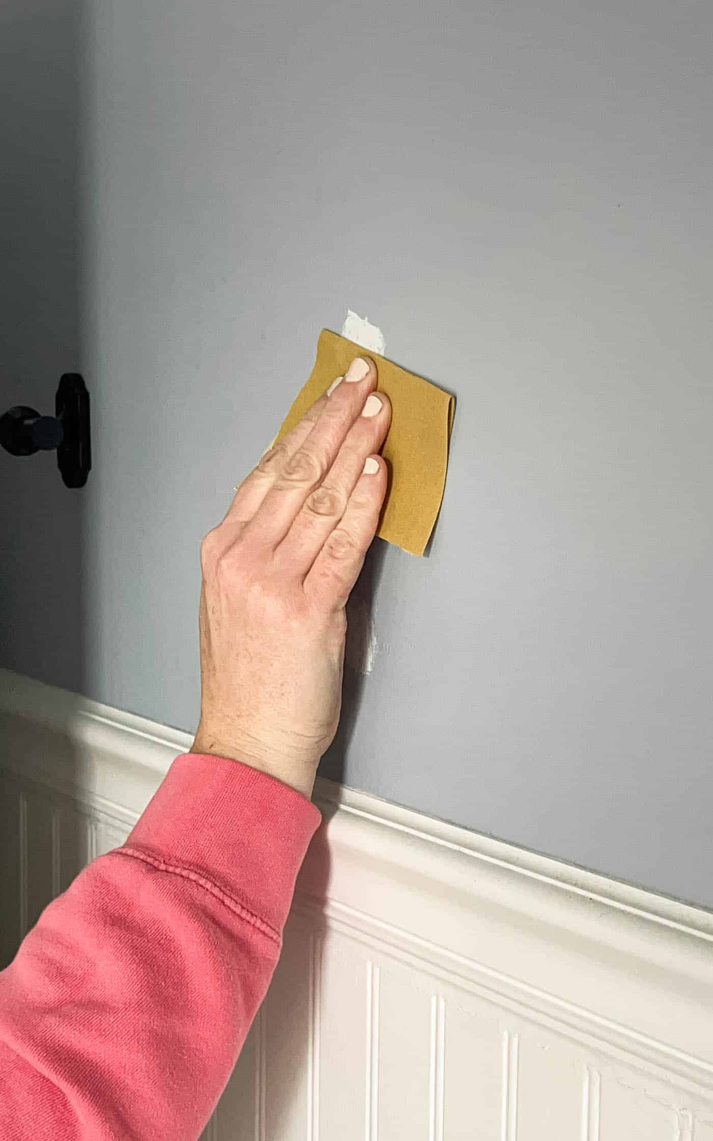 sand down dried spackling when filling a hole in drywall.