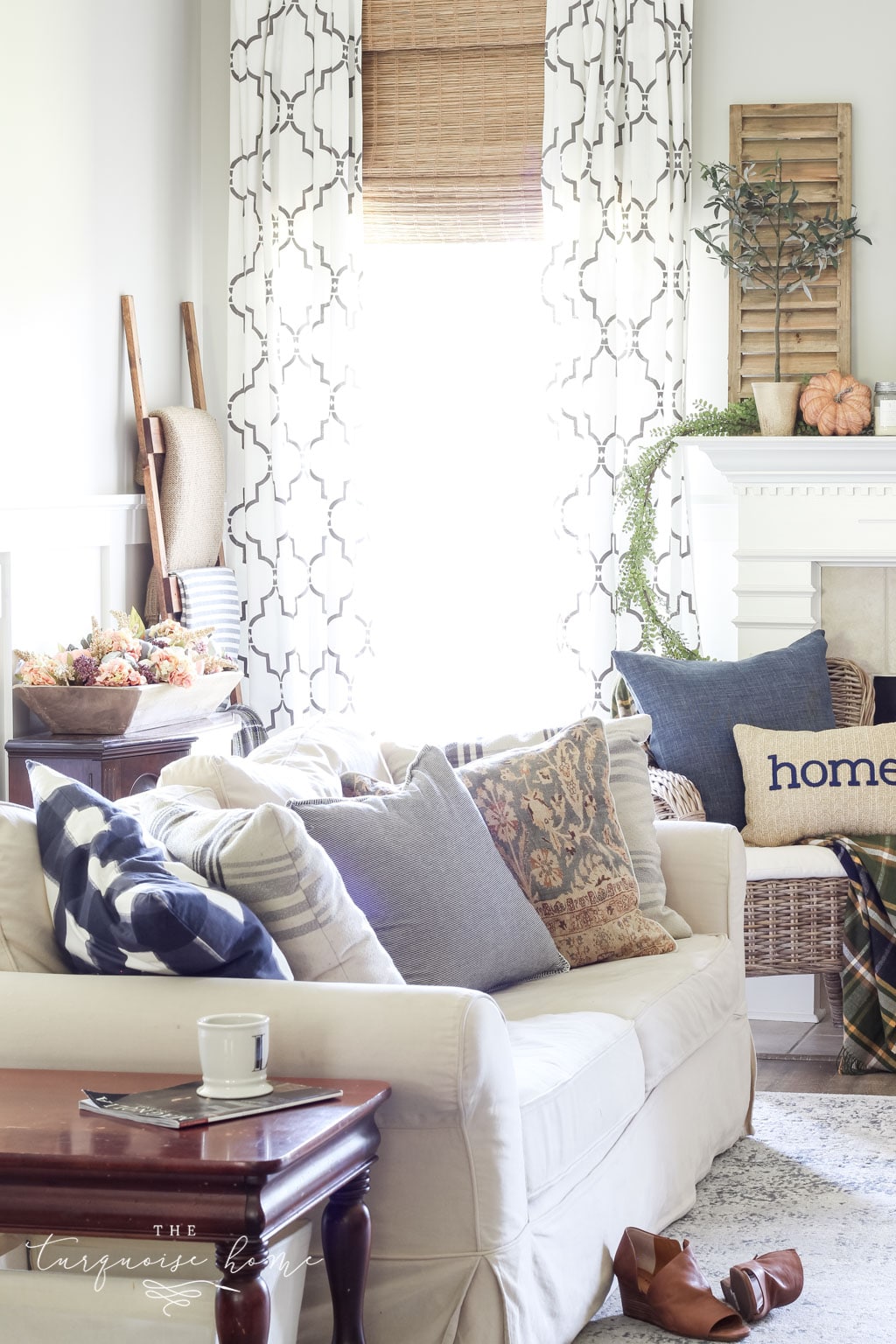 Fall Living Room Decor with mantel with wood shutter decor and browns and blues.