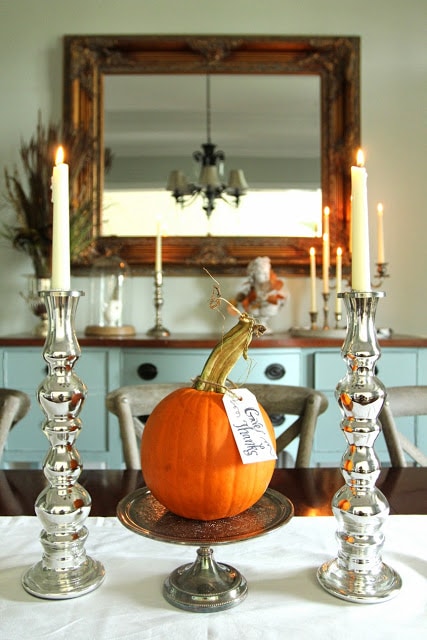 use large silver candlesticks for thanksgiving table decor