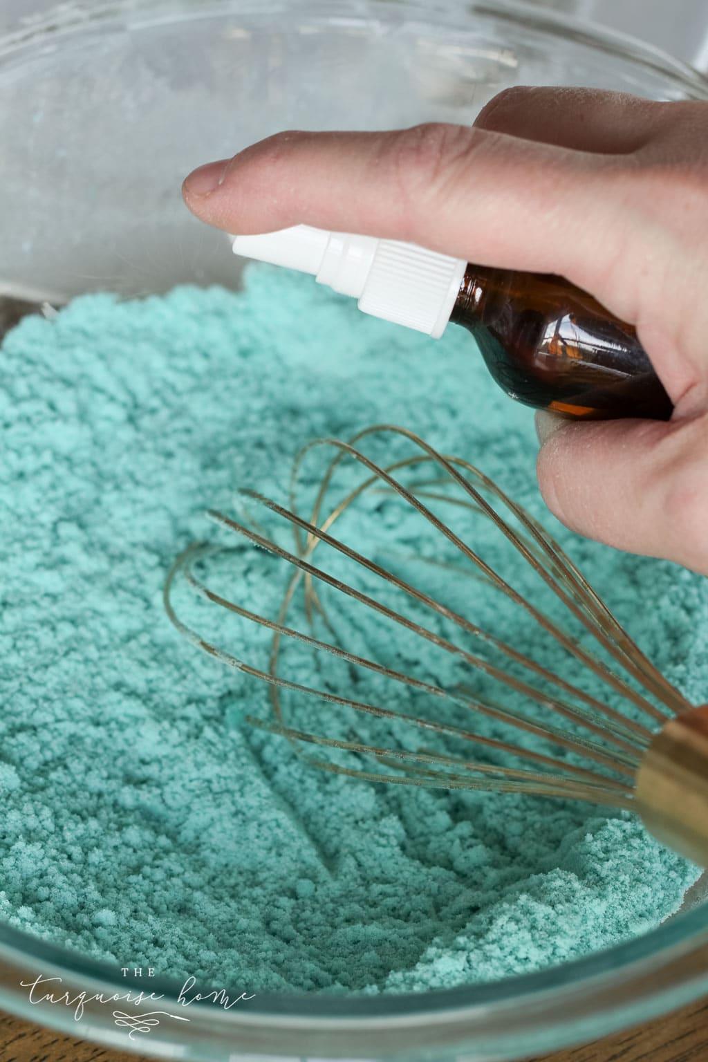 DIY Bath Bombs - mist the mixture just a little bit to give it the consistency of snow.
