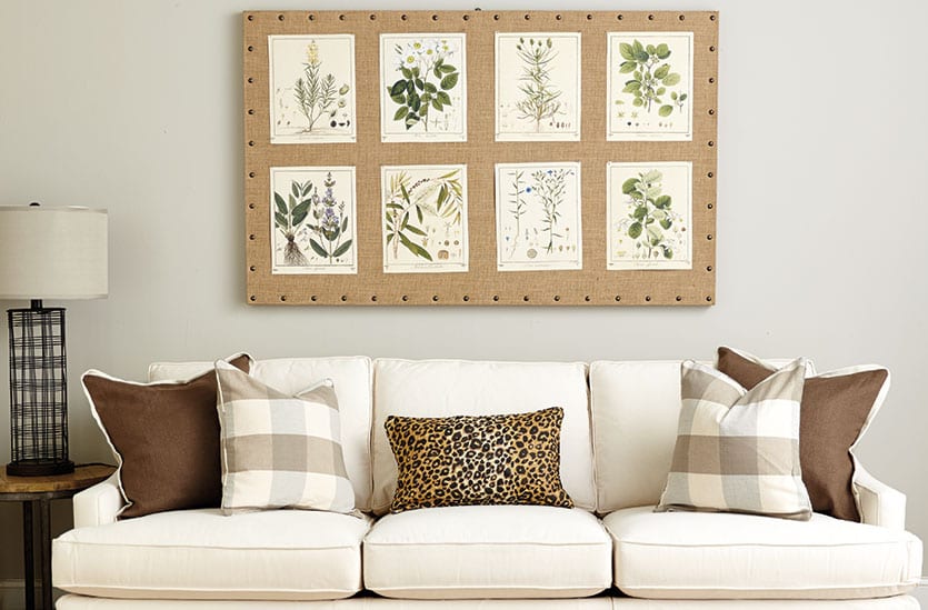 How high to hang art over a couch