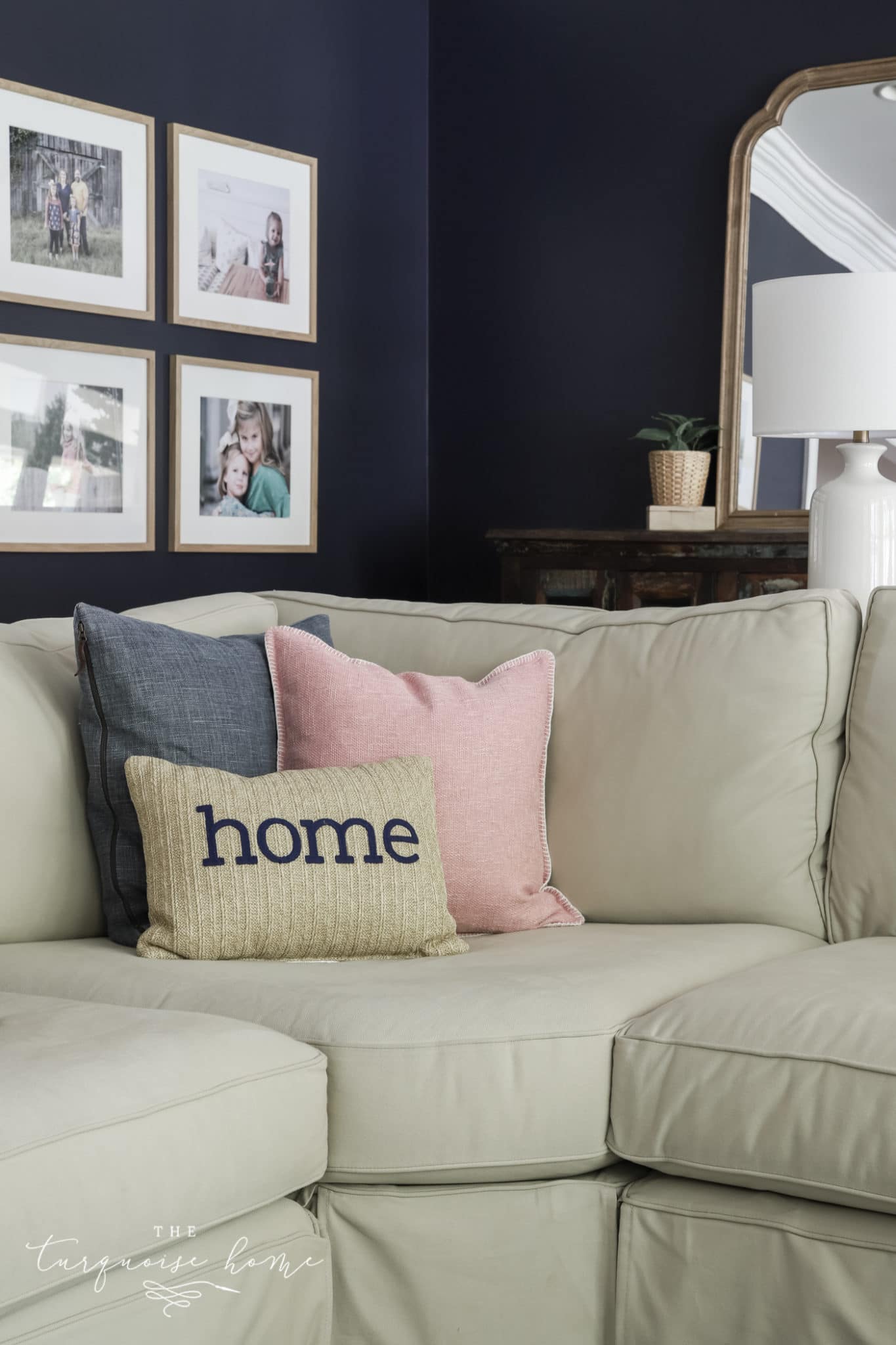 Two large square pillows with a bolster pillow in front