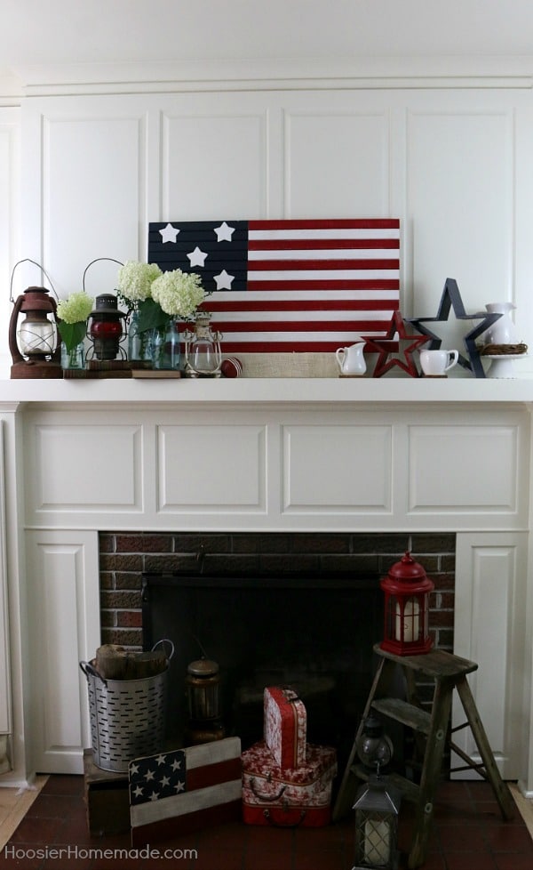 red, white, and blue stars and stripes mantel decor with white hydrangea blooms