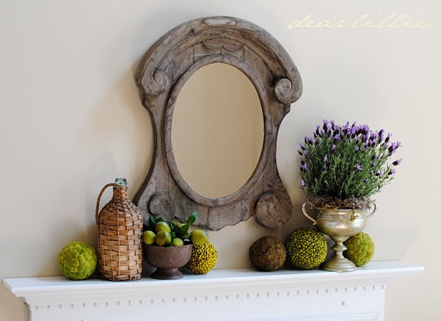 rustic farmhouse mirror with limes and potted lavender mantel decor