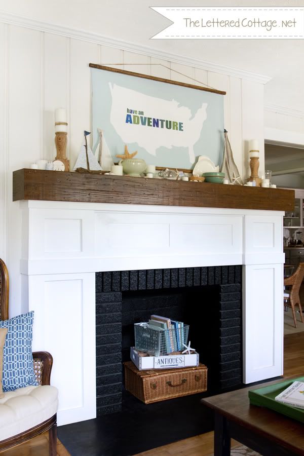 beach inspired fireplace mantel decor with shells and boats