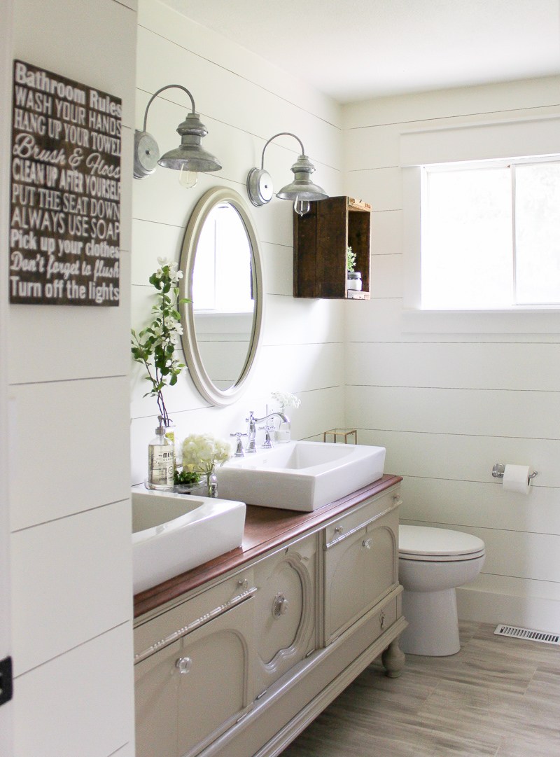 cozy farmhouse bathroom with a 2 sink vanity
