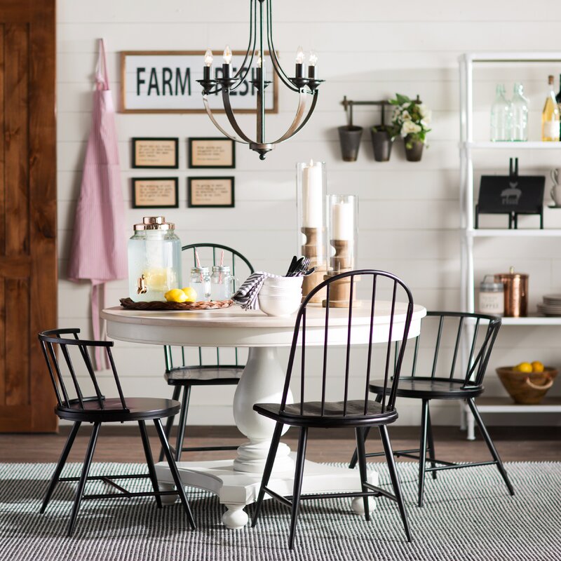empire style chandelier over kitchen dining table.