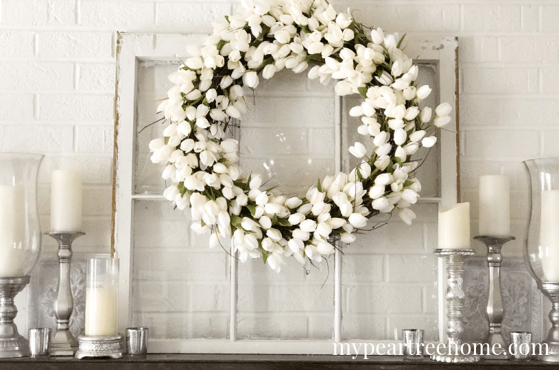lovely white-themed spring fireplace mantel decor with white tulip wreath