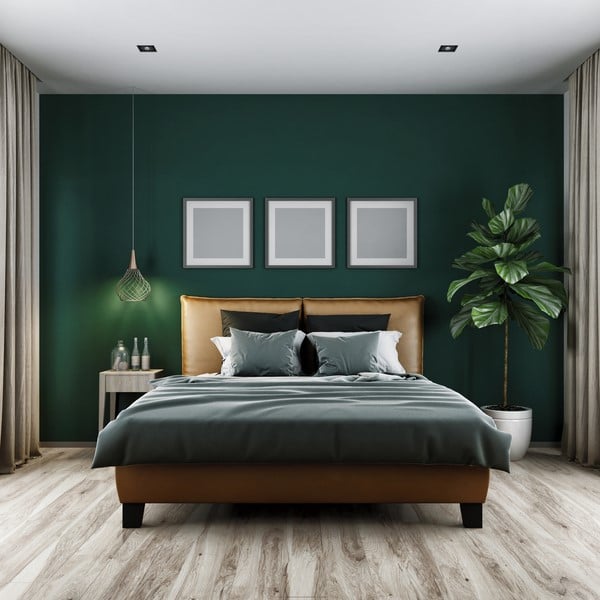 Hunter Green by Benjamin Moore in a lush, moody bedroom.