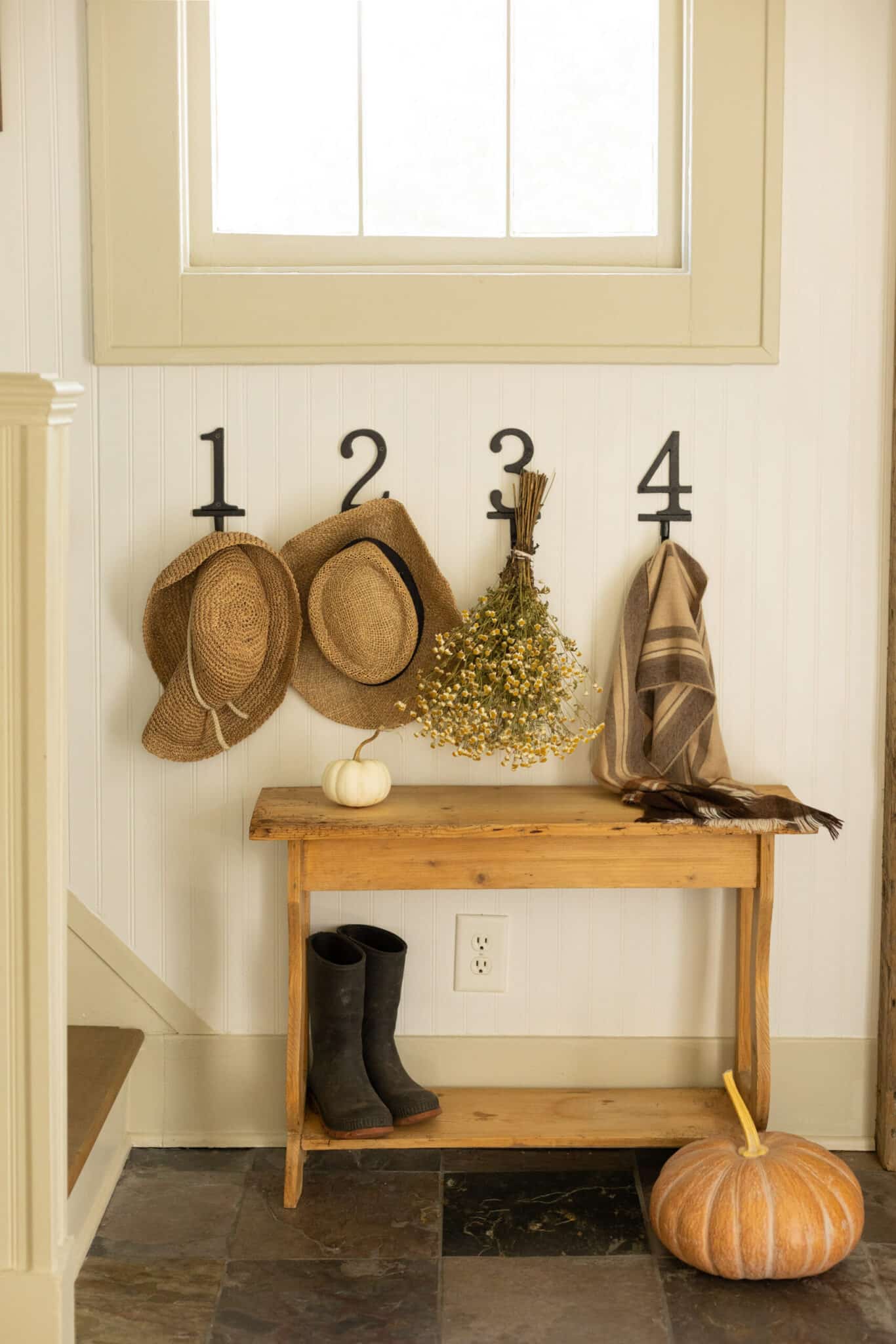numbered hooks in entryway from pine and prospect home