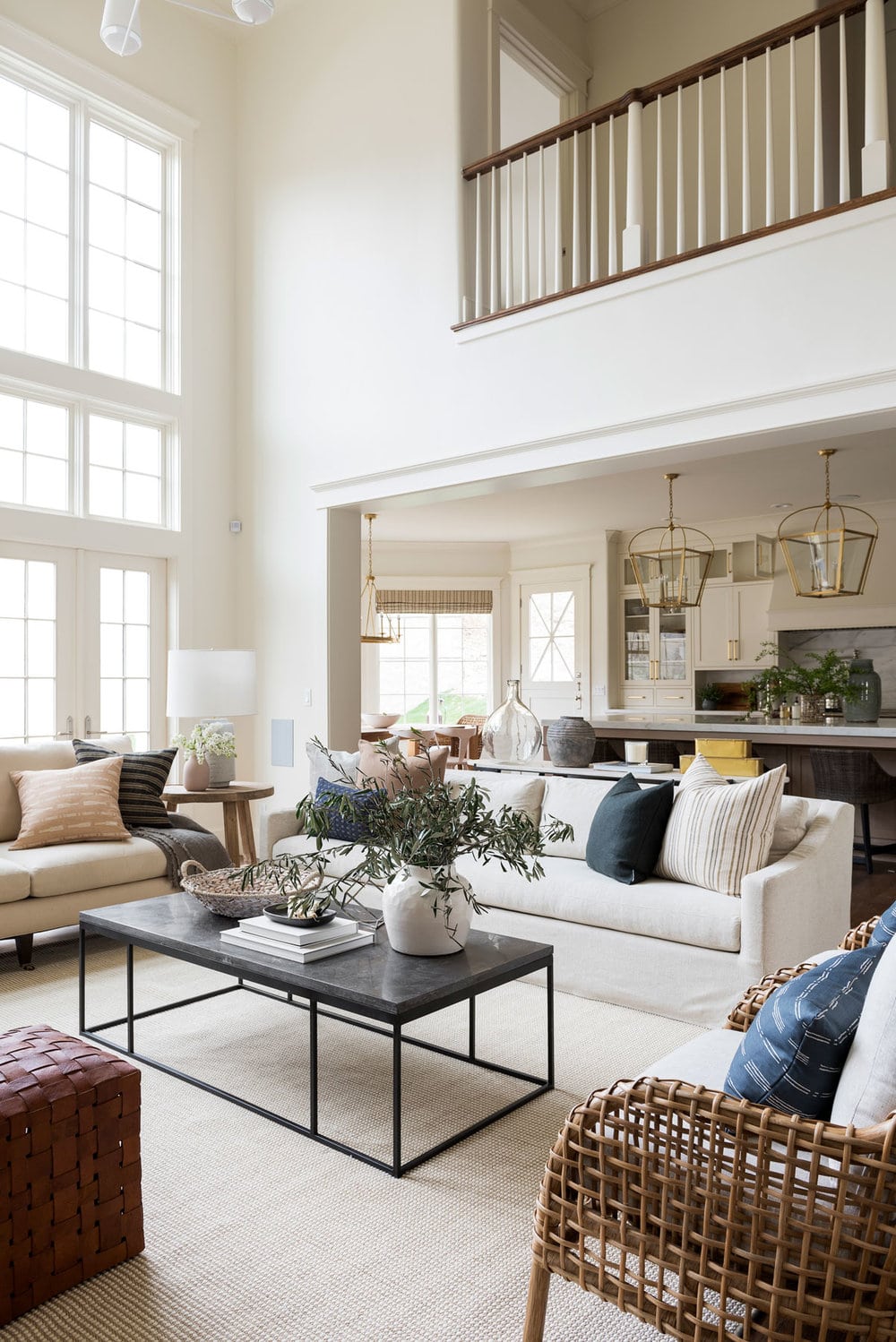 large airy living room painted in Swiss Coffee by Benjamin Moore
