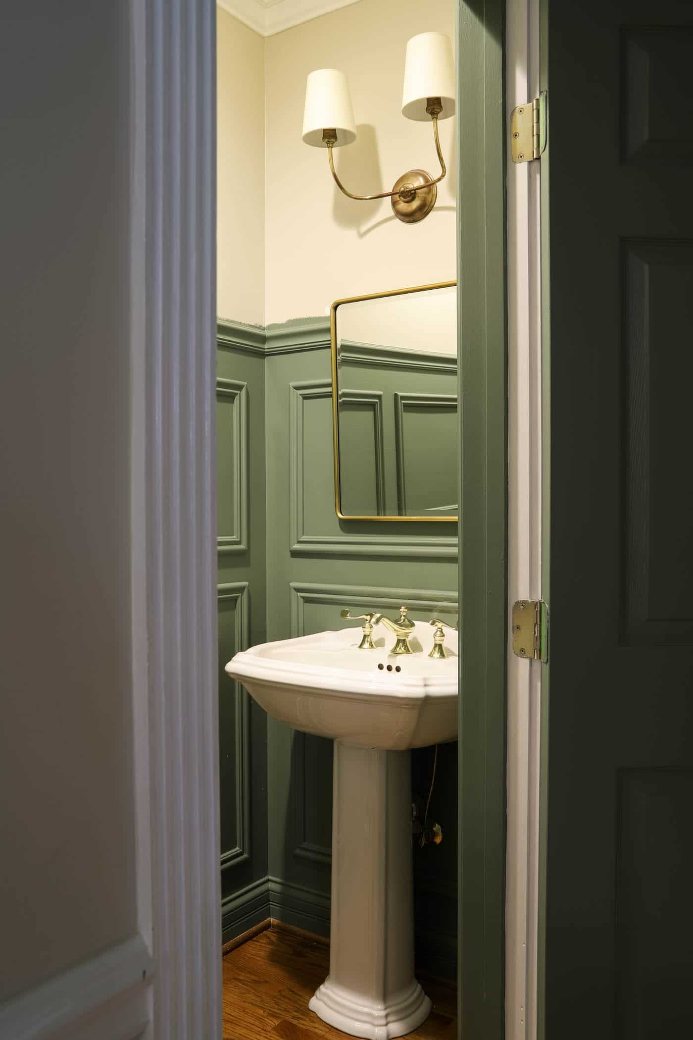 Caulke Green Powder Room with Picture Frame Moulding