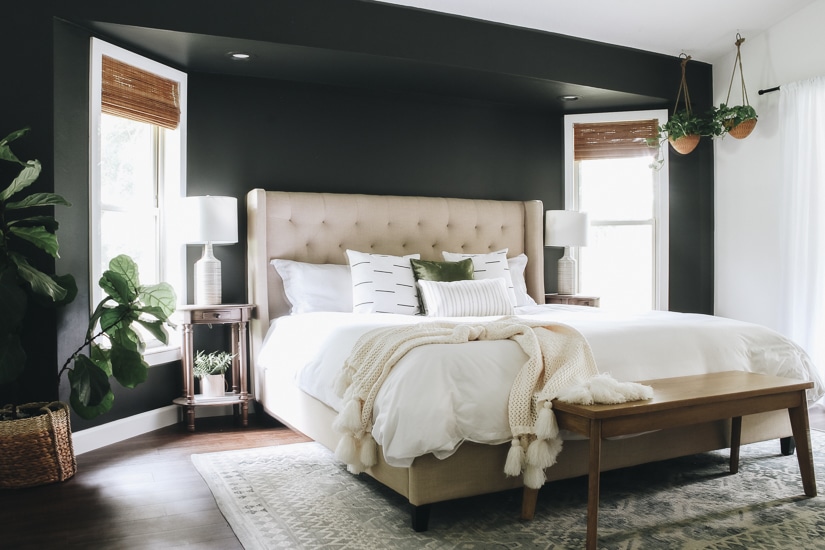 Iron Ore accent wall behind a bed