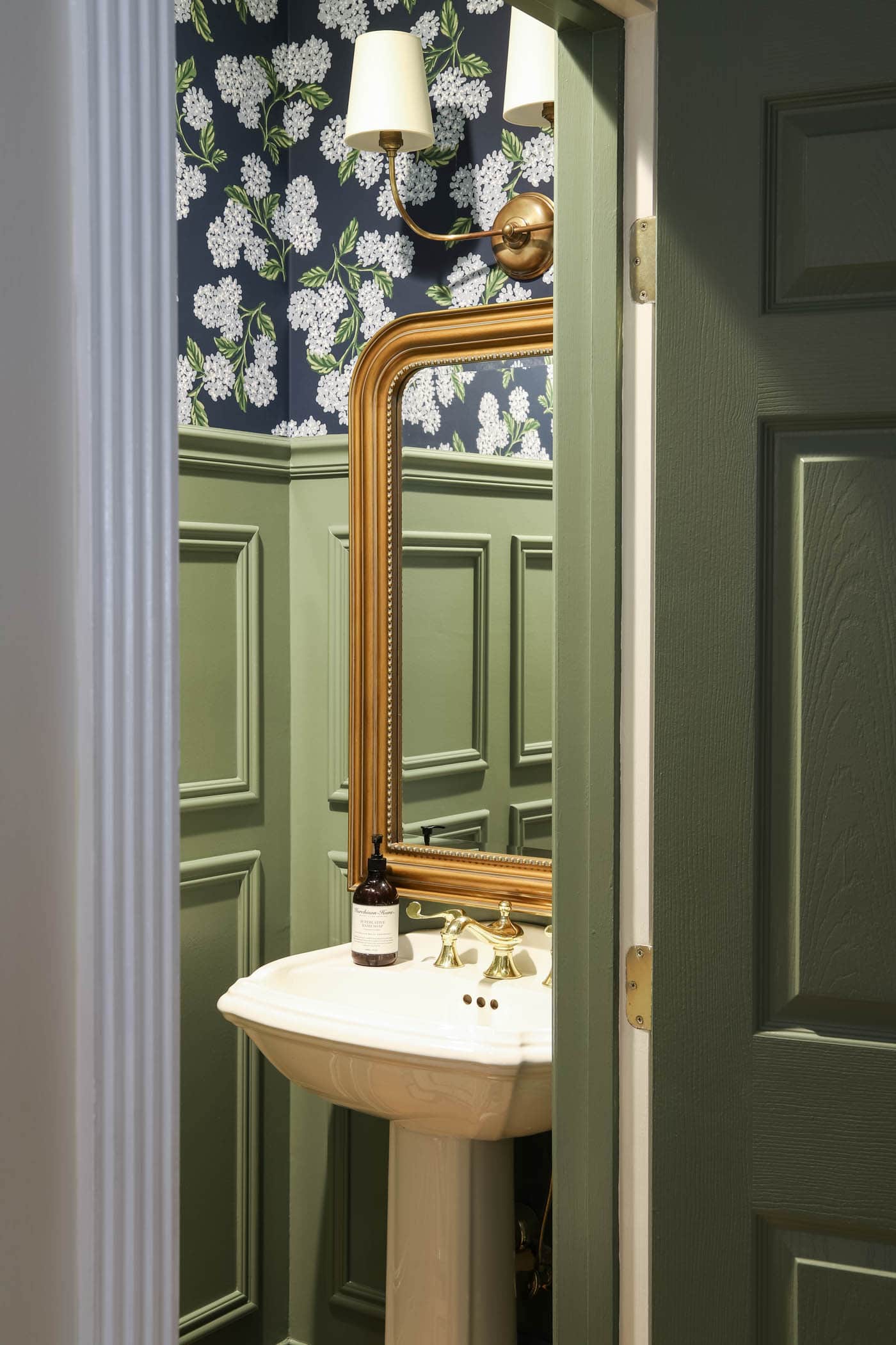 Blue Green Powder Room with brass mirror