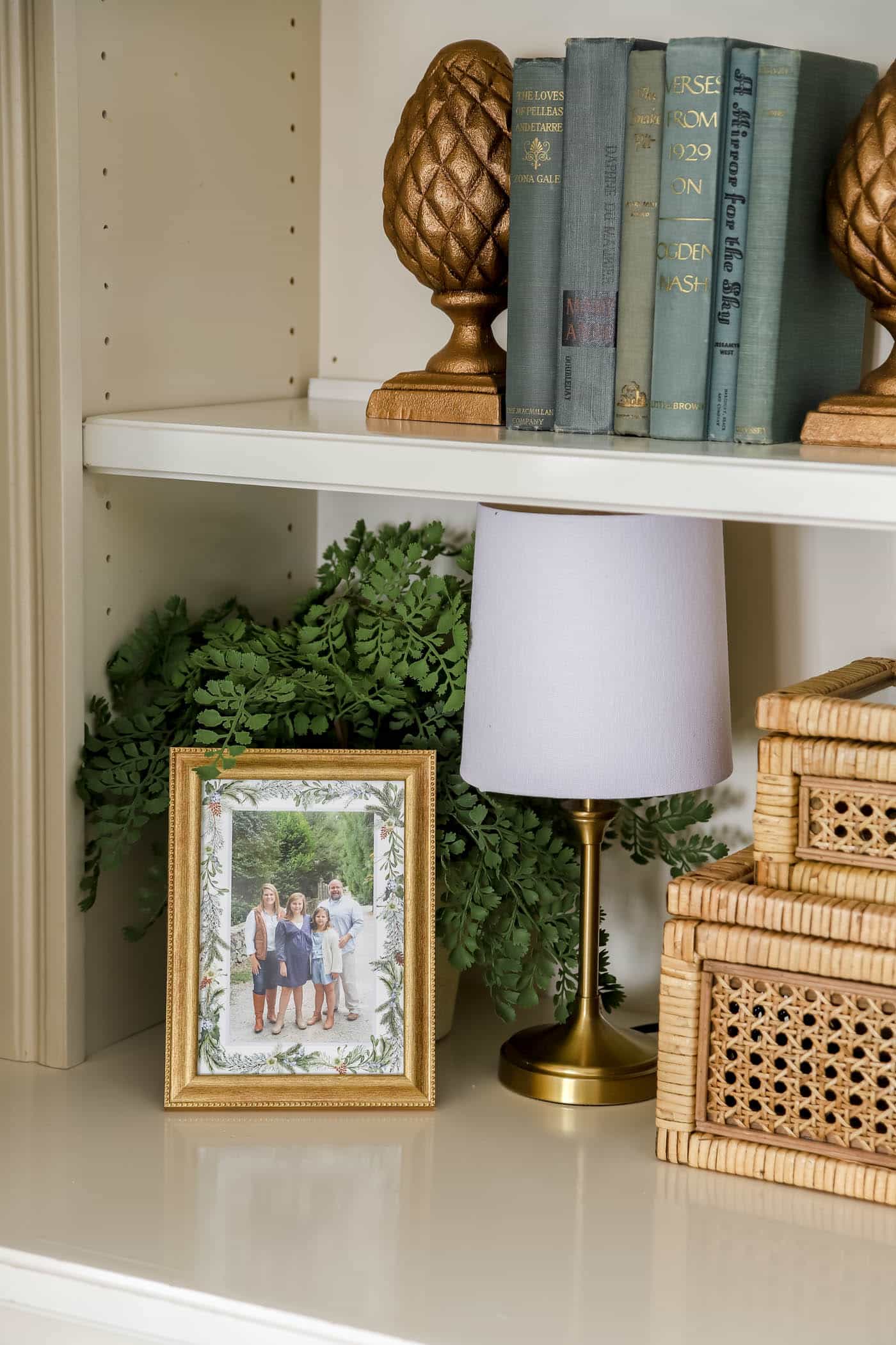 gold and blue bookshelf decor.